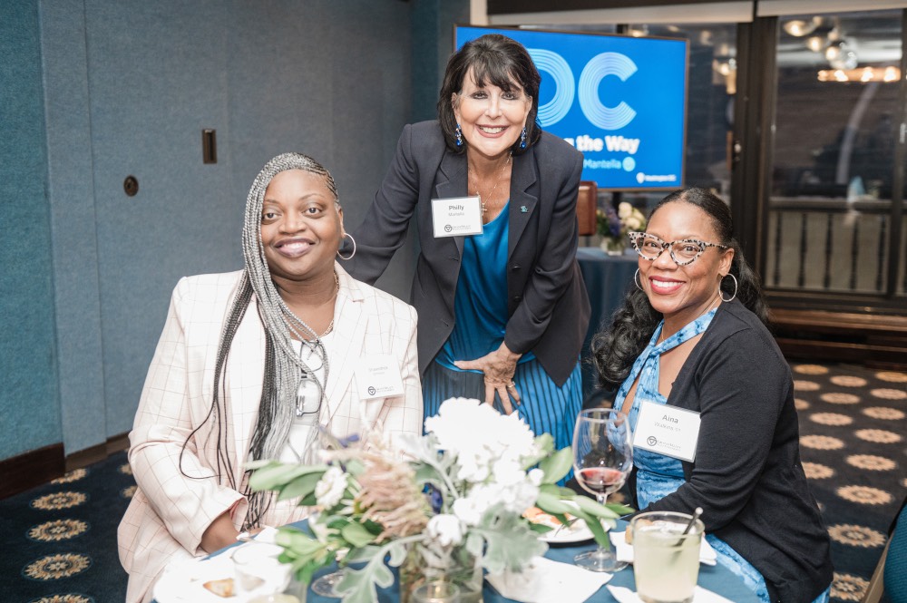 President Mantella smiles with 2 GVSU Alumnae